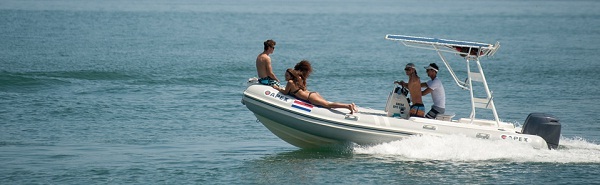 people enjoying sailing on a rigid Inflatable sailing boat