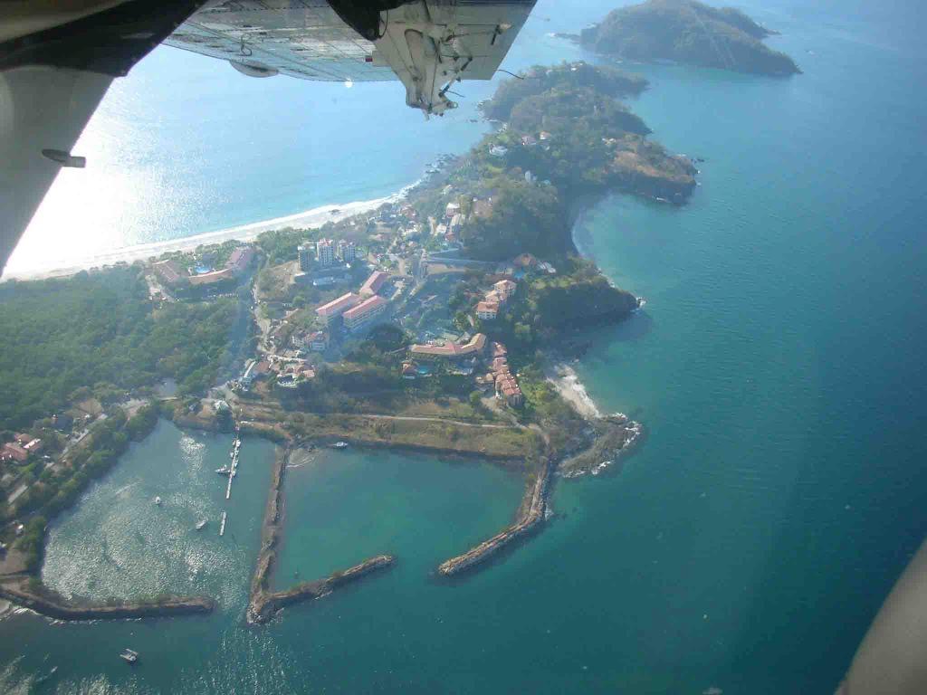 Playa Flamingo and its marina basin from the air
