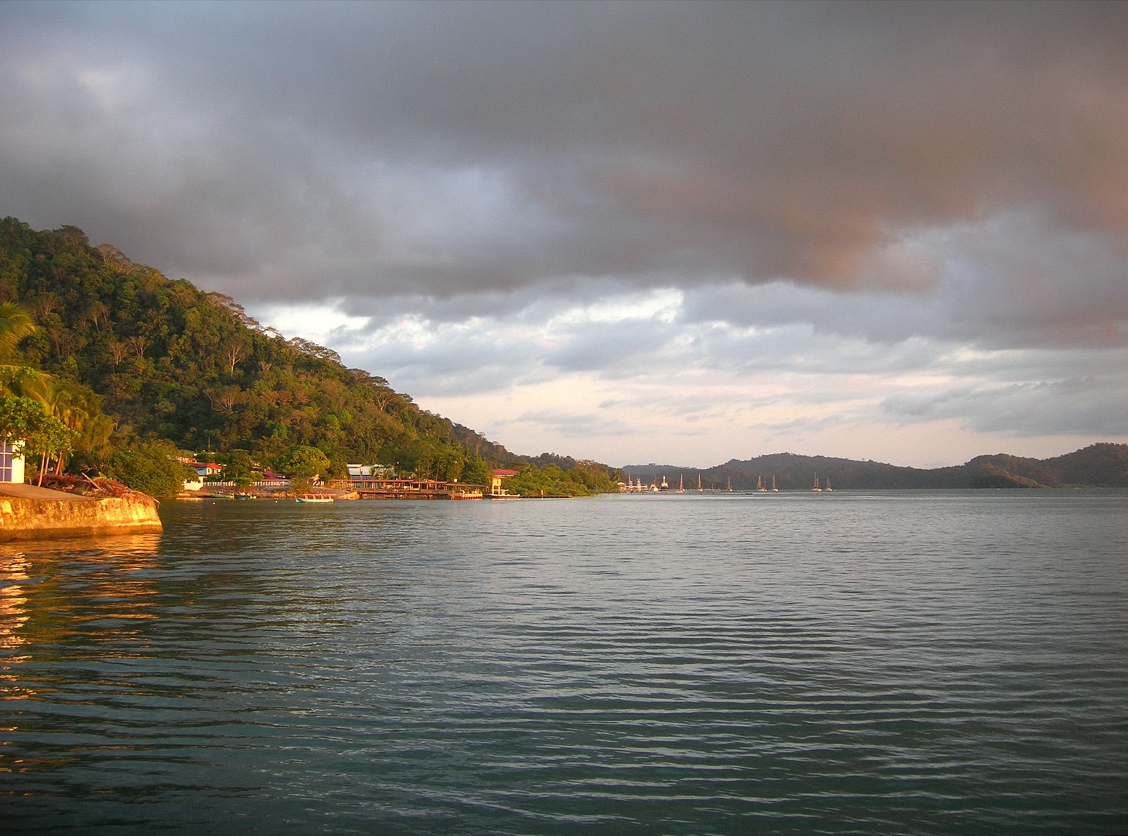 Late afternoon light over Golfito bay and its moored boats