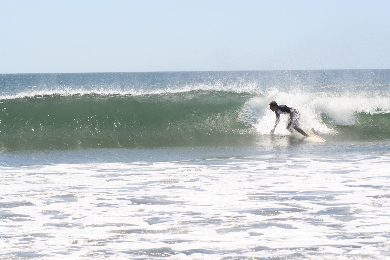 A surfer on a wave at Roca Bruja, Guanacaste